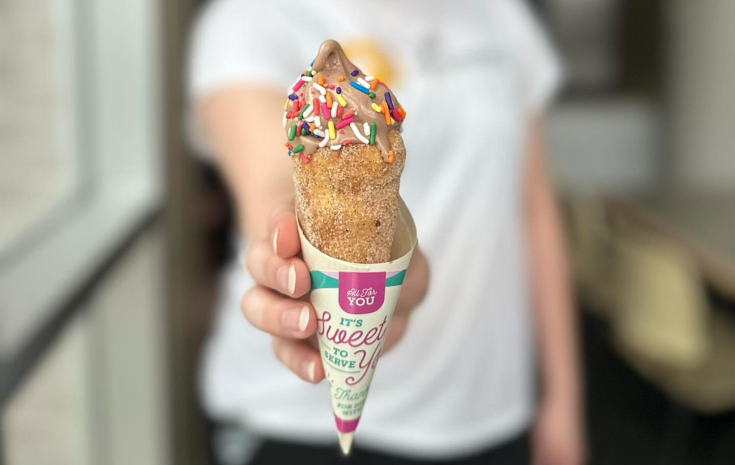 server holding an ice cream cone